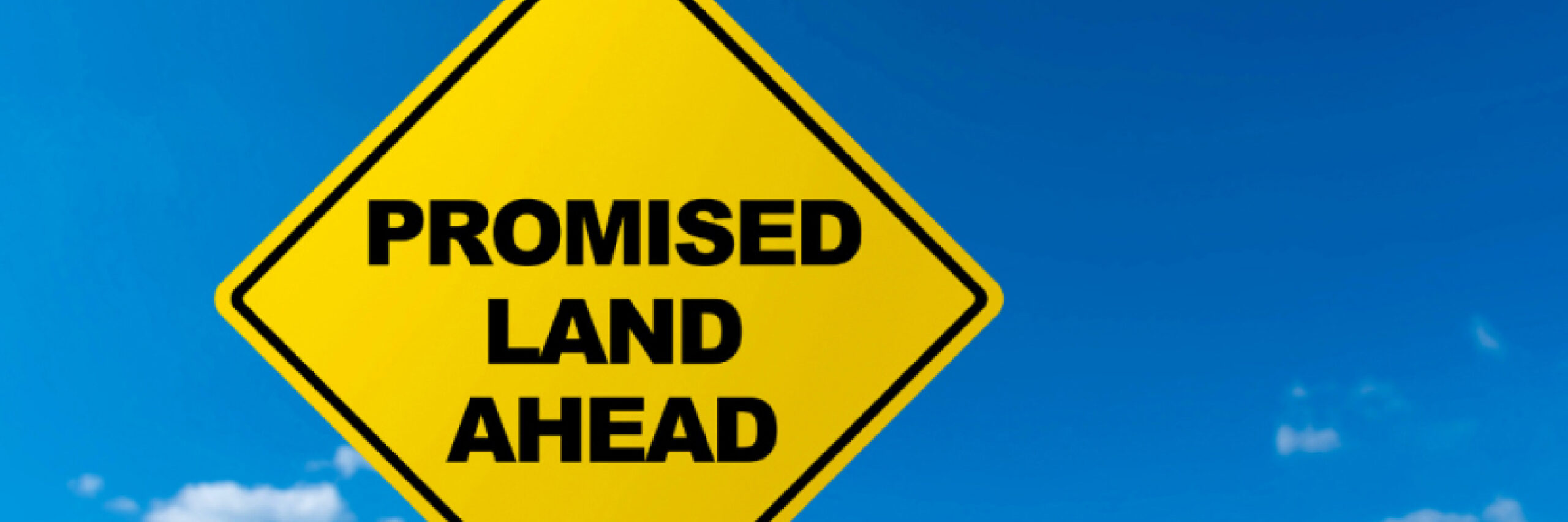 Promised land ahead sign